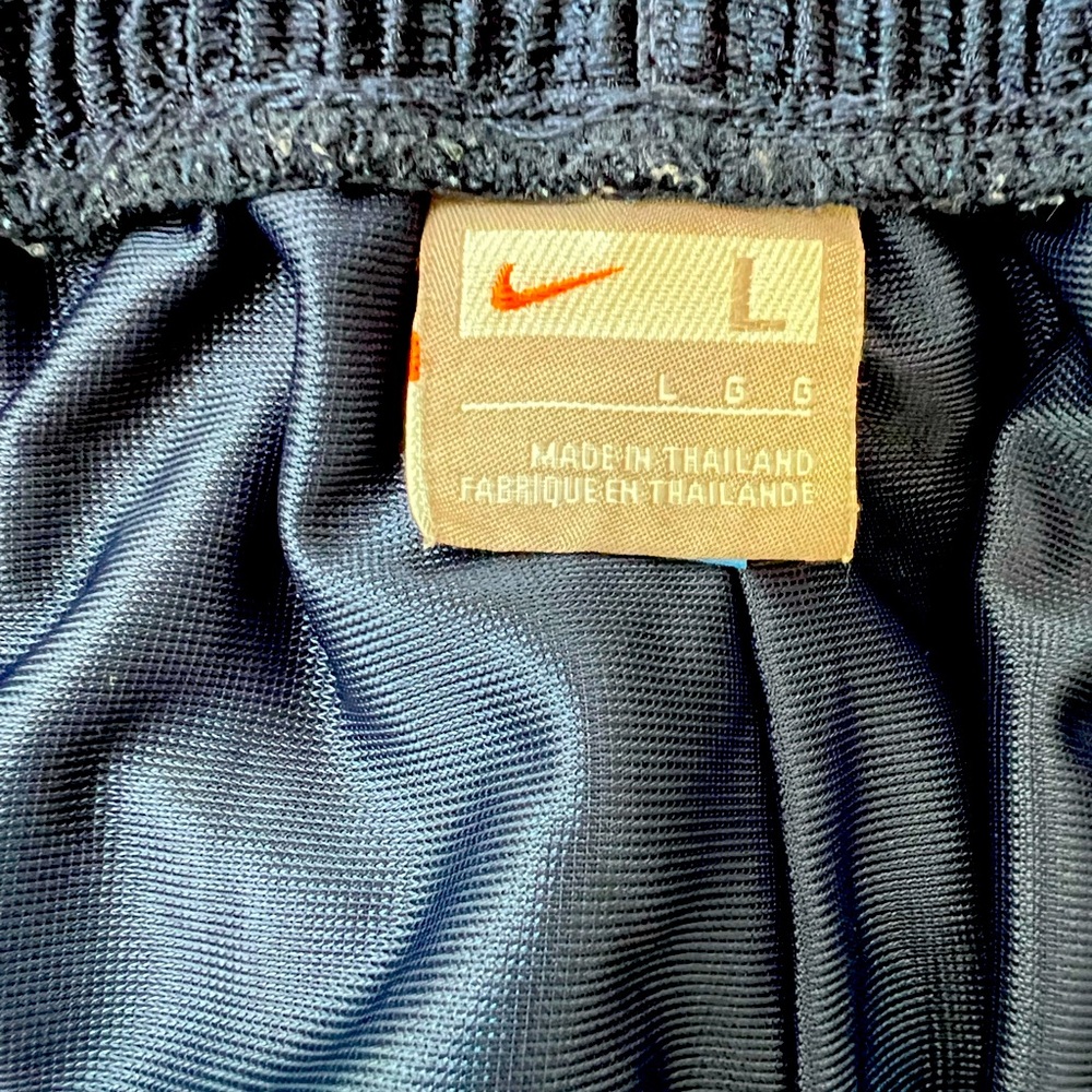 Gently worn vintage Nike basketball shorts; men’s large with 9-inch inseam.